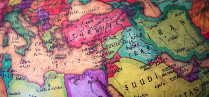 A printed political map of the Middle East with country borders picked out in bright colors